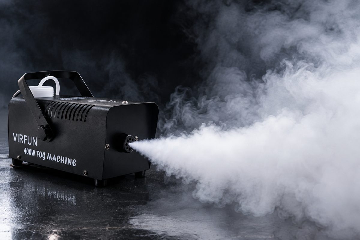 Fog machine filling the air with dense fog